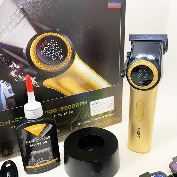 Професійна машинка для стрижки волосся VGR V-001 з дисплеєм 9000 об/хв та 10 насадками. Колір: золотий 00014896 фото