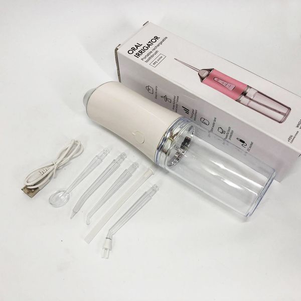 Ирригатор для чистки зубов и полости рта oral irrigator с аккумулятором и сменными насадками. цвет: белый 00014507 фото