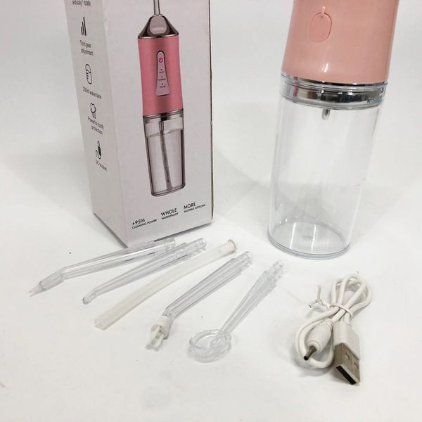 Ирригатор для чистки зубов и полости рта oral irrigator с аккумулятором и сменными насадками. цвет: розовый 00014508 фото