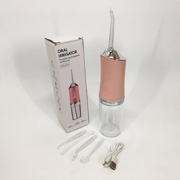 Ирригатор для чистки зубов и полости рта oral irrigator с аккумулятором и сменными насадками. цвет: розовый 00014508 фото