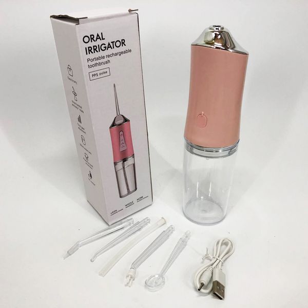Ирригатор для чистки зубов и полости рта oral irrigator с аккумулятором и сменными насадками. цвет: розовый 00014508 фото