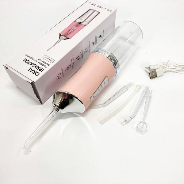 Ирригатор для чистки зубов и полости рта oral irrigator с аккумулятором и сменными насадками. цвет: розовый 00014508 фото