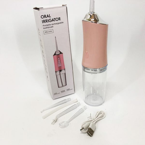 Ирригатор для чистки зубов и полости рта oral irrigator с аккумулятором и сменными насадками. цвет: розовый 00014508 фото