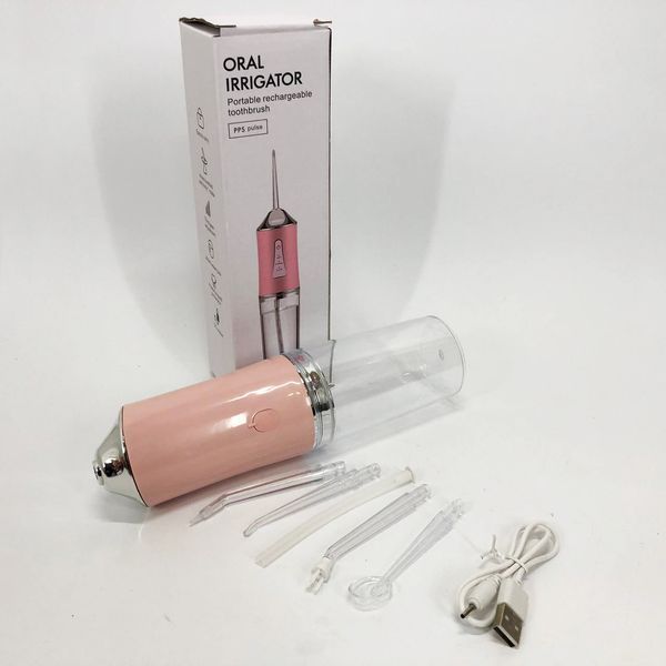 Ирригатор для чистки зубов и полости рта oral irrigator с аккумулятором и сменными насадками. цвет: розовый 00014508 фото