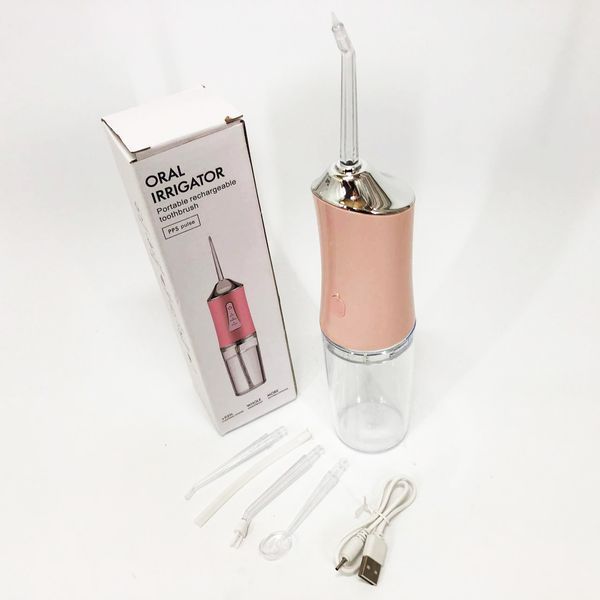 Ирригатор для чистки зубов и полости рта oral irrigator с аккумулятором и сменными насадками. цвет: розовый 00014508 фото