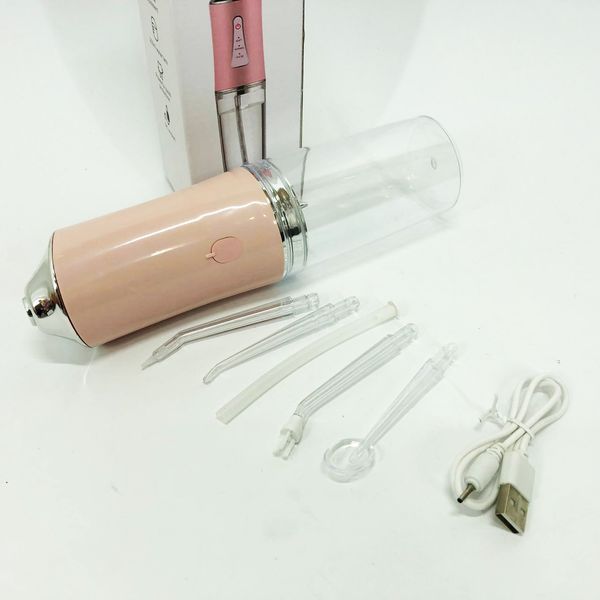 Ирригатор для чистки зубов и полости рта oral irrigator с аккумулятором и сменными насадками. цвет: розовый 00014508 фото