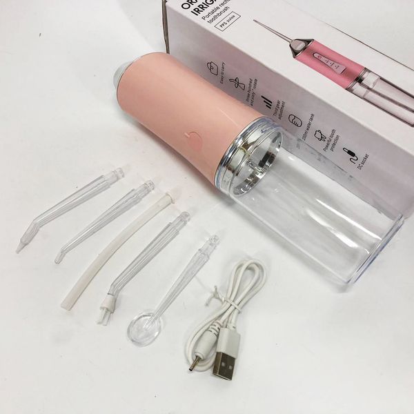 Ирригатор для чистки зубов и полости рта oral irrigator с аккумулятором и сменными насадками. цвет: розовый 00014508 фото