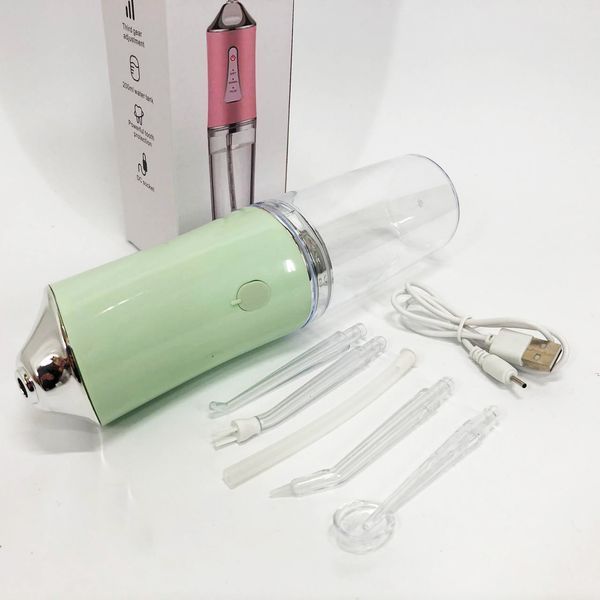Іригатор для чищення зубів та порожнини рота oral irrigator з акумулятором та змінними насадками. колір: зелений 00014509 фото