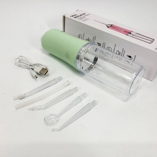Іригатор для чищення зубів та порожнини рота oral irrigator з акумулятором та змінними насадками. колір: зелений 00014509 фото