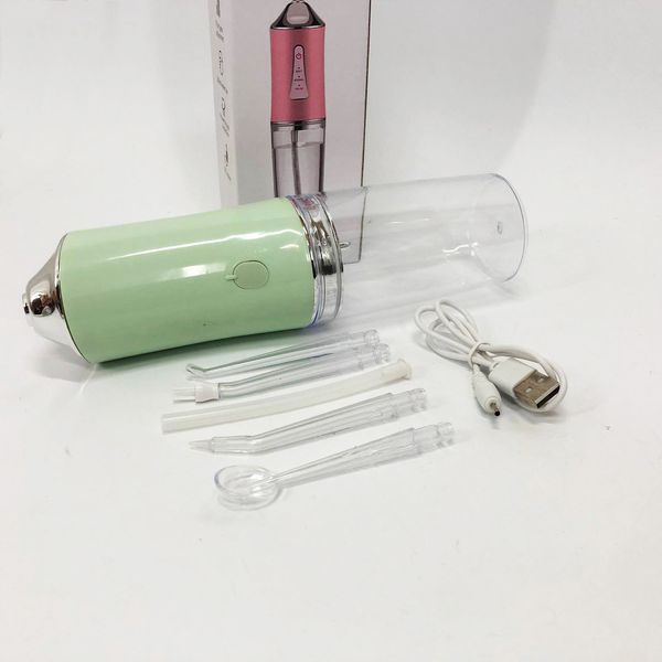 Іригатор для чищення зубів та порожнини рота oral irrigator з акумулятором та змінними насадками. колір: зелений 00014509 фото
