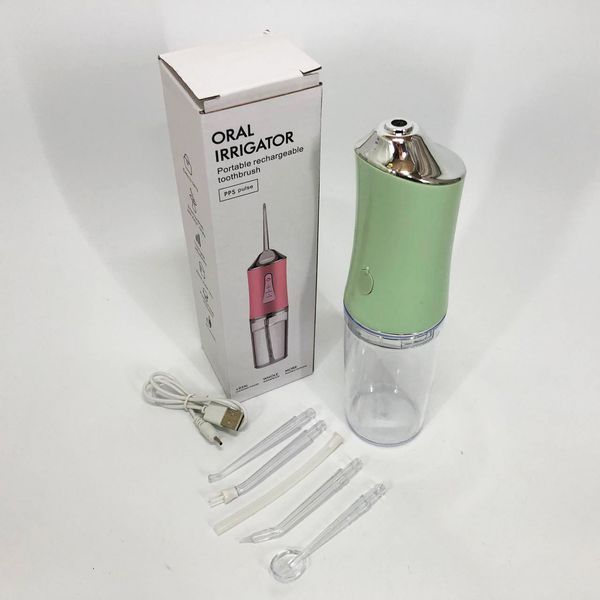 Іригатор для чищення зубів та порожнини рота oral irrigator з акумулятором та змінними насадками. колір: зелений 00014509 фото