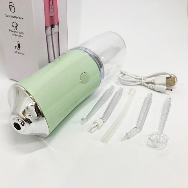 Іригатор для чищення зубів та порожнини рота oral irrigator з акумулятором та змінними насадками. колір: зелений 00014509 фото