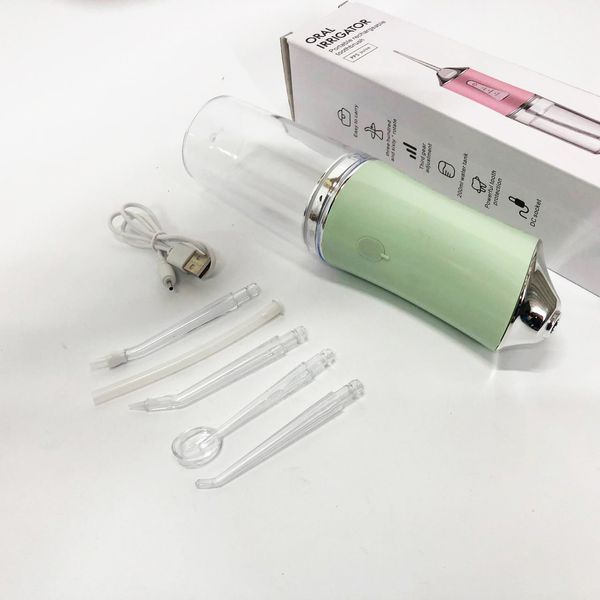 Іригатор для чищення зубів та порожнини рота oral irrigator з акумулятором та змінними насадками. колір: зелений 00014509 фото