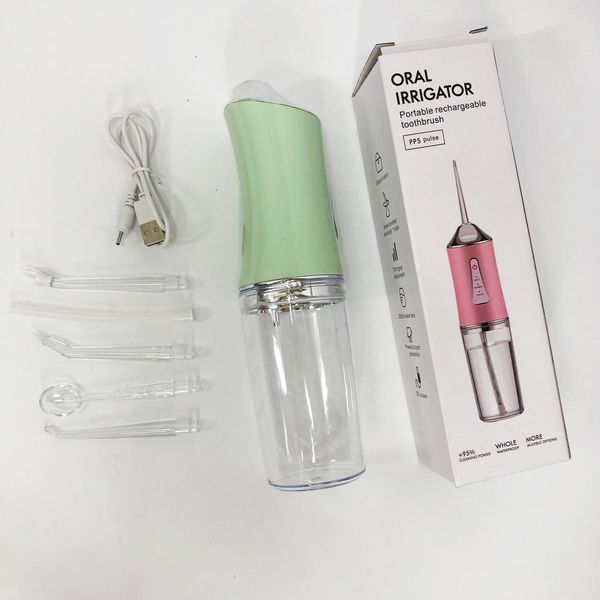 Іригатор для чищення зубів та порожнини рота oral irrigator з акумулятором та змінними насадками. колір: зелений 00014509 фото