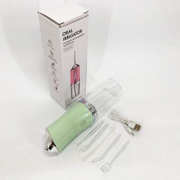 Іригатор для чищення зубів та порожнини рота oral irrigator з акумулятором та змінними насадками. колір: зелений 00014509 фото