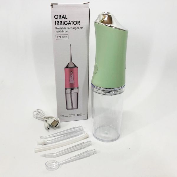 Іригатор для чищення зубів та порожнини рота oral irrigator з акумулятором та змінними насадками. колір: зелений 00014509 фото