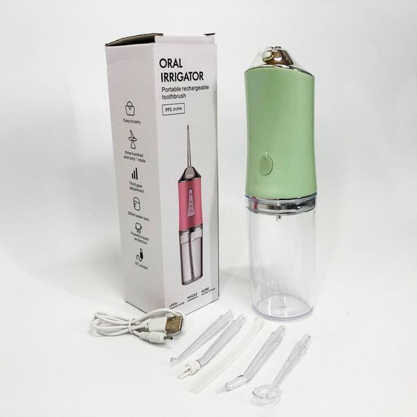 Іригатор для чищення зубів та порожнини рота oral irrigator з акумулятором та змінними насадками. колір: зелений 00014509 фото
