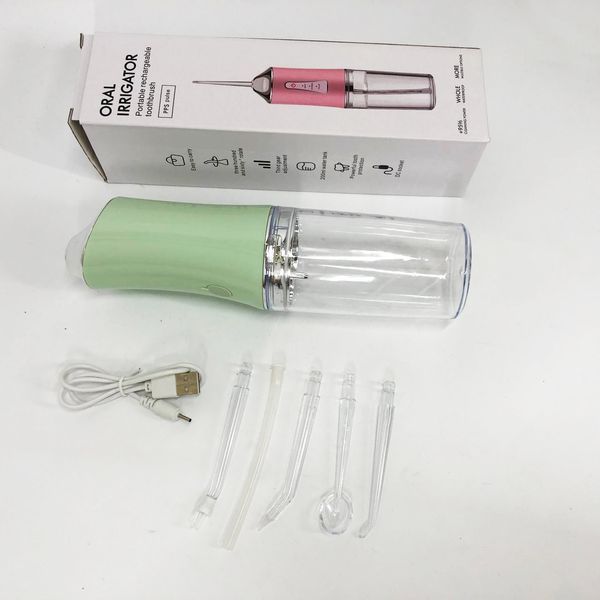 Іригатор для чищення зубів та порожнини рота oral irrigator з акумулятором та змінними насадками. колір: зелений 00014509 фото