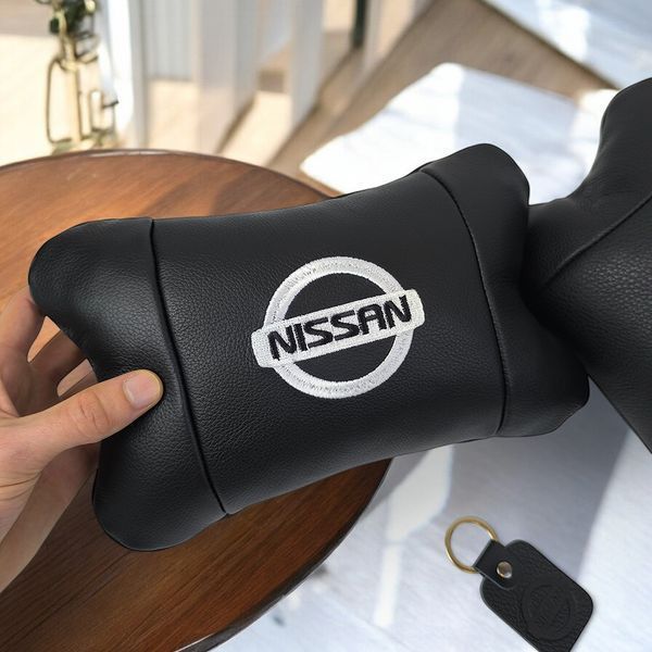Подушки в авто 2 шт Nissan, натуральная кожа, с логотипом Ниссан, на подголовник для вашей машины 00016804 фото