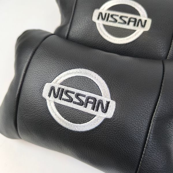 Подушки в авто 2 шт Nissan, натуральная кожа, с логотипом Ниссан, на подголовник для вашей машины 00016804 фото